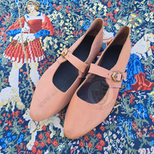 15th century shoes side by side