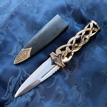 celtic dagger on blue background